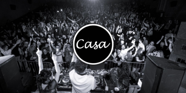 Black and white crowd with Casa logo in front