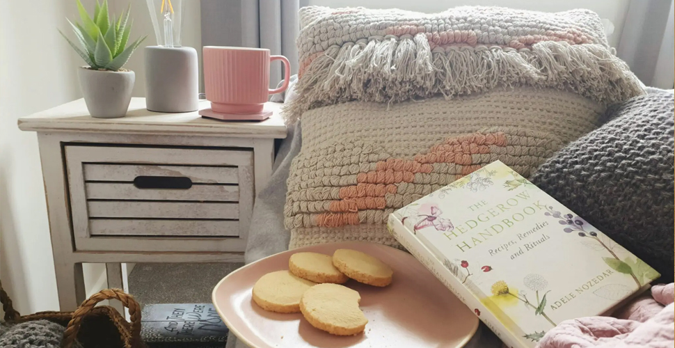 Bedroom accessories styled with a plate of shortbread biscuits and a book