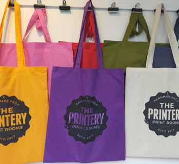 Totebags with 'The Printery' handprinted on it